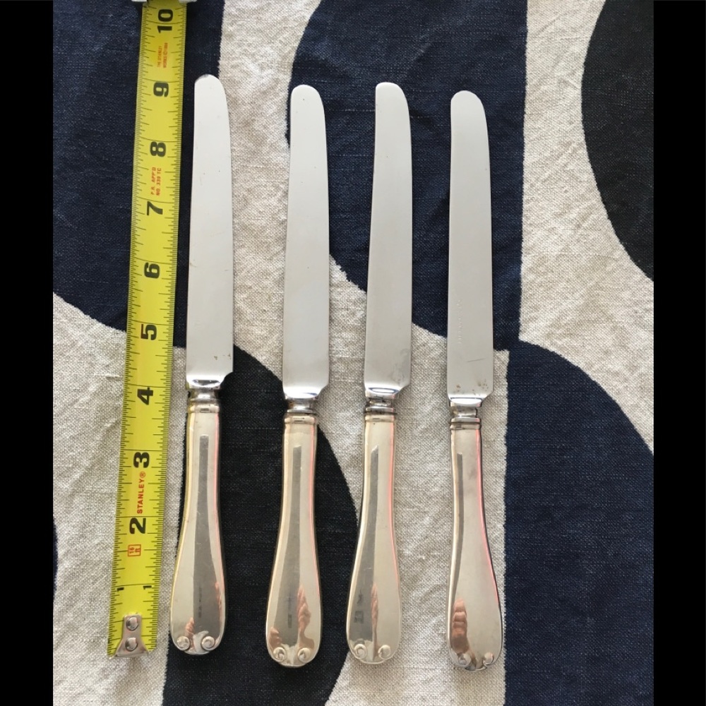 Set of 4 Tiffany Flemish pattern sterling luncheon knives. No monogram.